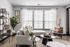 Chic and modern living room with bright natural light from large windows.