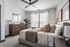 Elegant bedroom with large window with abundant natural light.