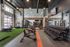Modern fitness center showcasing a variety of workout equipment, sleek design, and vibrant lighting for an energizing atmosphere.