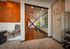 Modern fitness room with exercise balls and yoga studio.