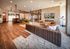Luxurious open-concept clubhouse lounge with modern furniture, cozy seating, and a stylish fireplace.