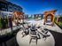 Luxurious apartment community showcasing stylish outdoor seating, elegant pergolas, and a refreshing poolside ambiance.