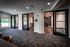 Modern co-working space with sleek glass doors, stylish furnishings, and ample natural light.