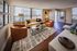 Bright and modern living room with large windows.