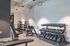 Modern gym featuring a diverse range of weights and sleek exercise equipment, ideal for fitness enthusiasts.