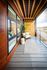 Chic outdoor balcony with modern wood paneling offering a serene view of the city.