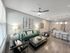 Bright open-concept living and dining space with modern furniture and chic decor.