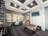 Luxurious recreation room featuring elegant decor, a foosball table, and a large scenic wall art.