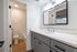Contemporary bathroom with elegant vanity, stylish mirror, and inviting natural light.