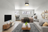 Chic studio apartment with modern decor, featuring a cozy bed beside a stylish couch, geometric rug, and a wall-mounted TV, creating a welcoming, open-concept living space.