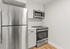 Contemporary kitchen with sleek stainless steel appliances, modern cabinetry, and minimalist design.