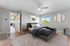 Bright and inviting bedroom with stylish d&eacute;cor, comfortable double bed, and a scenic window view.