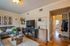 Inviting living room with cozy sofa, stylish decor, and natural light enhancing the modern ambiance.