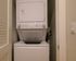 Convenient in-unit stackable washer and dryer optimally placed in a sleek laundry nook.
