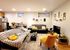Inviting living room featuring cozy seating, vibrant decor, and modern furnishings creating a warm atmosphere.