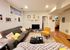 Cozy living room with plush seating, stylish decor, and a welcoming atmosphere, perfect for relaxation and entertainment.