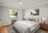 Bright and inviting bedroom featuring a plush bed, stylish nightstands, and a scenic window view.