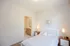 Bright and inviting bedroom with stylish decor and en-suite bathroom access.