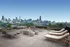 Luxurious rooftop terrace with modern lounge seating and panoramic city skyline views.