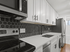 Modern kitchen design featuring sleek black hexagonal backsplash, elegant white cabinetry, and stainless steel appliances.