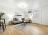 Contemporary living room with stylish decor, featuring a plush sectional sofa, modern lighting, and elegant wooden flooring for a cozy and inviting atmosphere.