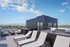 Berkeley, CO, Apartments Near Historic Elitch Theatre - The Irwin - Rooftop Deck With Lounge Seating, Sun Chaise Chairs, Gas Grills, And Panoramic Mountain Views Under Blue Sky.