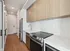 Modern kitchen with sleek stainless steel appliances, elegant cabinetry, and pristine countertops, offering a blend of style and functionality.