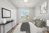 Berkeley, CO, Apartments Near Historic Elitch Carousel Dome - The Irwin - Bright Bedroom With Upholstered Headboard, Layered Bedding, Large Window, And Modern Ceiling Light.