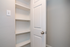 Convenient built-in shelving unit with a pristine white finish, perfect for stylish storage and organization.