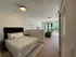 Modern studio apartment with an elegant split-level design, featuring a cozy sleeping area and a bright living space with large windows.