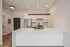 Sleek modern kitchen with a spacious island, stainless steel appliances, and elegant cabinetry.