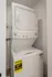 Efficient stackable washer and dryer set in a modern laundry nook, maximizing apartment space.