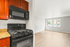Contemporary apartment featuring a modern kitchen with sleek appliances and an inviting open living space with natural light.