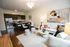 Old Town Chicago, IL, Apartments Near North Avenue Beach - 1537 N Orleans - Living Room With Modern Furniture, A Large Abstract Painting, And A Cozy Seating Area.