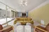 Sleek and modern lounge area with plush velvet sofas, stylish lighting, and expansive glass walls for natural light.