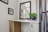 Chic corner with a sleek marble-top desk and elegant decor, perfect for a stylish home interior.