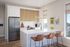 Modern kitchen with sleek appliances, white cabinetry, and a stylish breakfast bar adorned with chic brown chairs. Bright natural light enhances the spacious atmosphere.