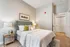 Inviting bedroom with cozy king-size bed, modern decor, and soft lighting, perfect for relaxation.