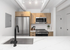 Modern kitchen with sleek stainless steel appliances, elegant marble countertop, and stylish wooden cabinetry, perfect for contemporary living.