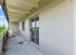 Spacious balcony with sleek design and scenic views, perfect for relaxation and enjoying nature.