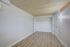Bright, spacious bedroom with elegant wood flooring and ample closet space, ready to personalize.