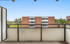 Inviting balcony view with fresh air and a picturesque cityscape backdrop.
