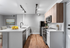 Elegant modern kitchen with sleek countertops, stainless steel appliances, and stylish wood cabinetry.