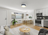 Bright and modern open-concept living area with a cozy dining space and a stylish kitchen, featuring sleek stainless steel appliances and contemporary decor.