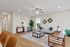 Inviting living room with modern furnishings, elegant decor, and natural light creating a warm, welcoming atmosphere.