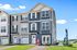 Bright and modern townhouse with sleek blue siding, large windows, and inviting entryway, perfect for contemporary living.