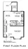 Inviting first floor plan featuring a spacious living room, modern kitchen, and cozy dining area, with convenient deck access and practical storage shed.