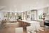 Bright open-concept living space with modern kitchen, dining area, and cozy living room.