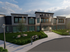 Modern apartment complex exterior with stylish architecture, landscaped gardens, and welcoming entrance at Spring Brook Park.