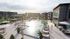 Luxurious apartment complex featuring a serene swimming pool surrounded by stylish lounge chairs and lush greenery, perfect for relaxation and leisure.